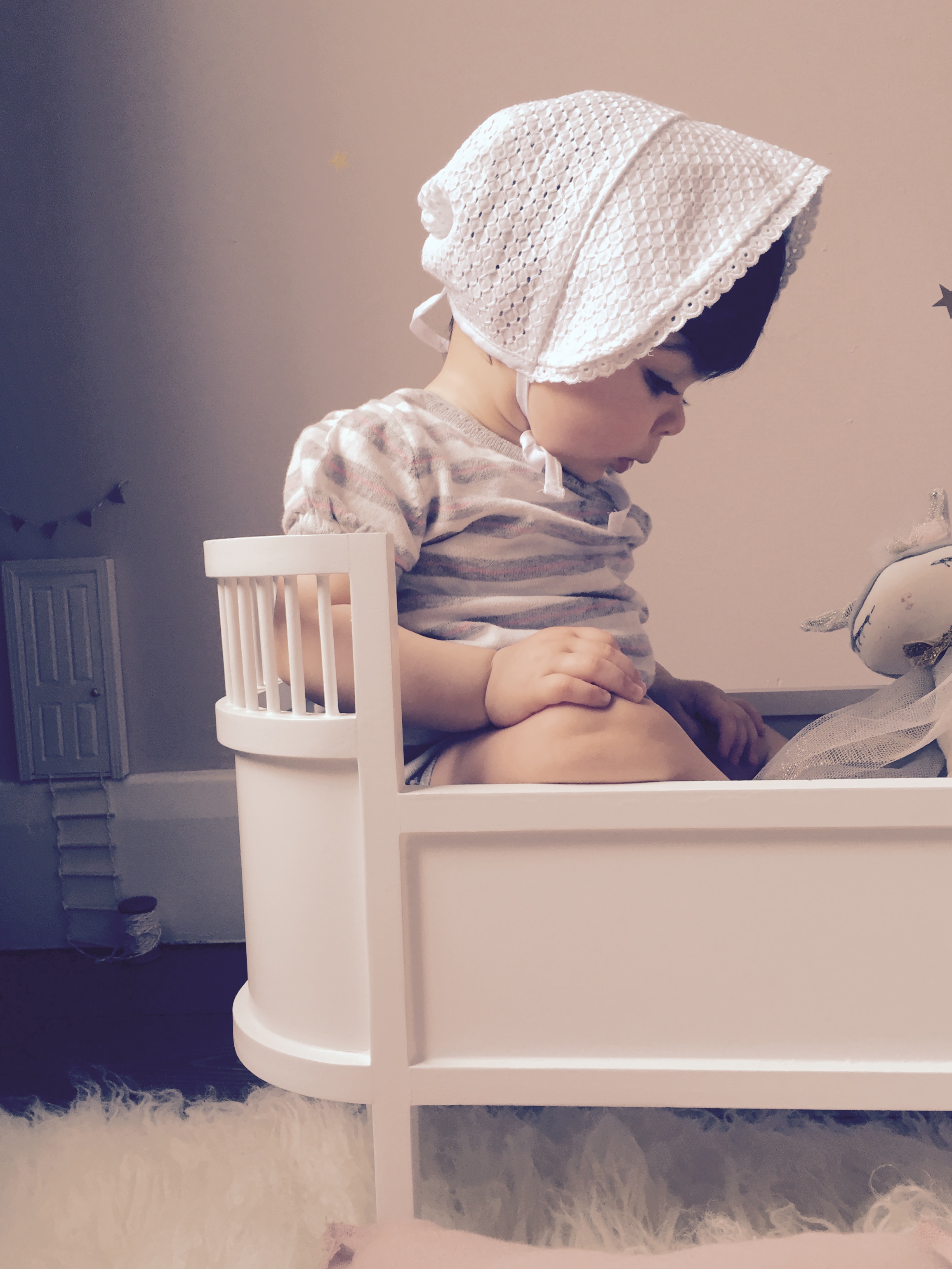 Preciously Me blog : My baby girl at 9 months playing in her doll cot